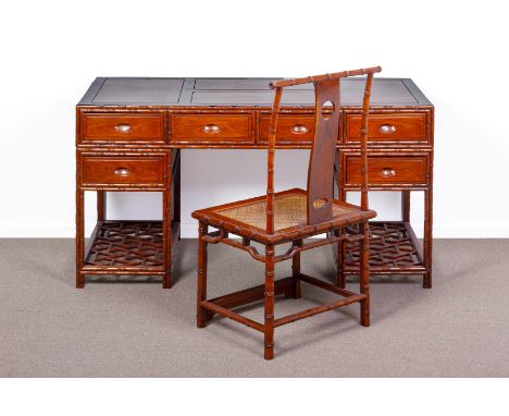 A CHINESE HARDWOOD AND BURLWOOD TWIN PEDESTAL DESK AND CHAIR
The top inset with burl wood panel above an arrangement of drawe