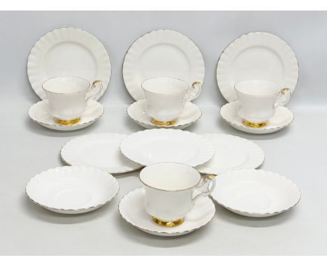 A 16 piece Royal Albert “Val D’or” tea service. Including a model plane and pewter dish.