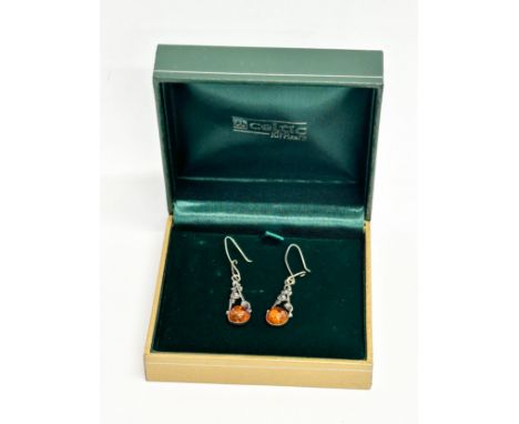 A pair of silver Celtic earrings with case.