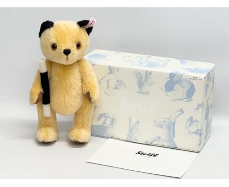 A Steiff bear with box and certificate.