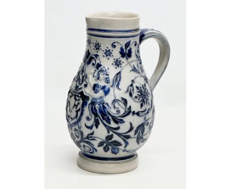 A Late 19th Century German salt glazed pitcher. Westerwald. 18x27cm.