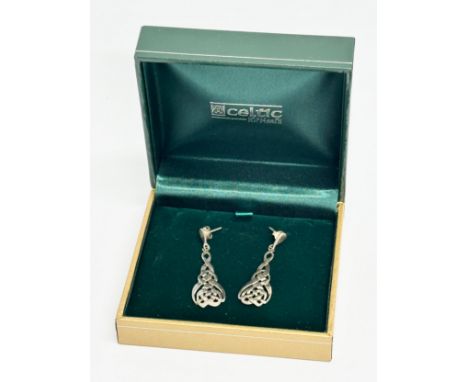 A pair of silver Celtic earrings with case.