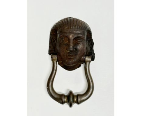 A Victorian Egyptian revival door knocker. 16cm.