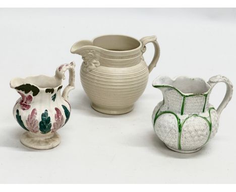 3 small 19th Century jugs. An Earlu 19th Century Ridgway drap stoneware jug, with Doric spout, 1800-1815. 2 Staffordshire jug