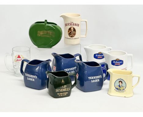 A collection of vintage advertising jugs. Mostly by Wade. Old Bushmills, Tennent’s Lager, Sullivans, King George IV Old Scotc