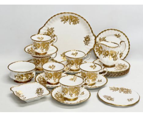 A 23 piece Royal Albert “Golden Rose” tea service.