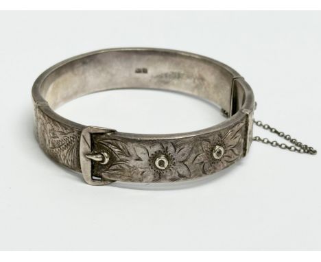 A Joseph Smith &amp; Sons silver bangle. 18.91 grams. 6.5x6cm