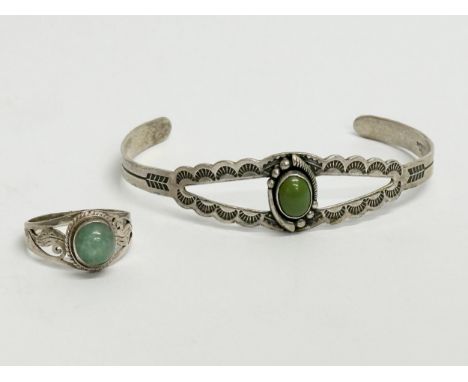 A silver bangle and ring. Ring size N. Bangle 6x5cm
