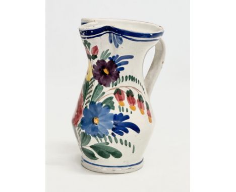 A 19th Century Italian Majolica pitcher. 13x15x19.5cm.