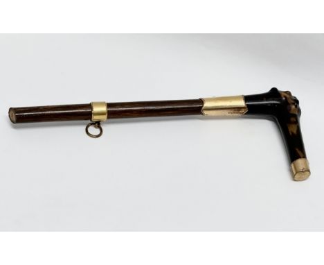 An 18ct gold mounted walking stick top. Stamped G.P