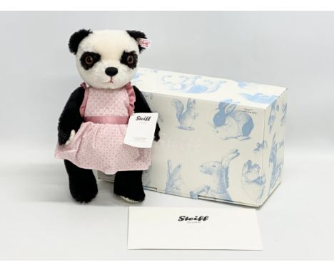 A Steiff bear with box and certificate.