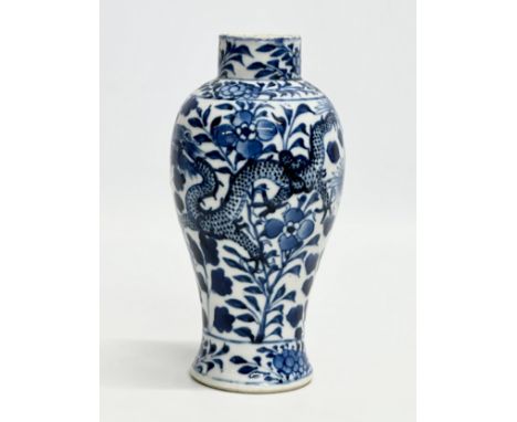 A 19th Century Chinese blue and white baluster vase. Kangxi 4 character. 18.5cm.
