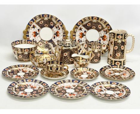 A 19th Century Imari porcelain tea service. Red Crown Mark. Davenport/Derby. 16 pieces.