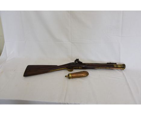 An 18th century brass barrel flint lock blunderbuss by H. Nock of London, the brass barrel with flared muzzle and attached ba