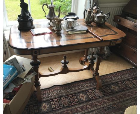 A Biedermeier style walnut inlaid centre table, on bobbin turned supports united by a flattened under-tier with urn form fini