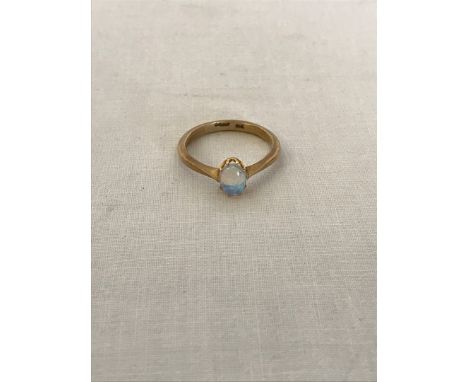 A 9ct gold ring set with an oval opal.  Est £20-40