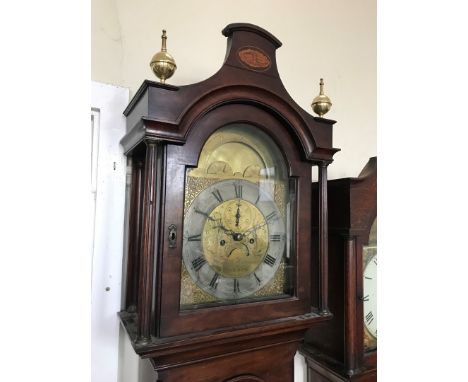 An 18th century mahogany cased longcase clock by Thomas Higgins of London, the hood with two brass orb finials and central ma