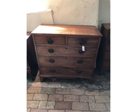 A 19th century mahogany chest of two short and three long drawers with oval brass back plates and bracket feet.  36ins wide. 