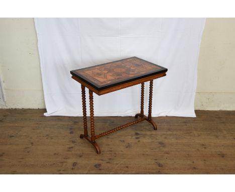 A mid 19th century writing table, the top veneered with exotic timbers in a geometric pattern, on bobbin turned legs, out-spl