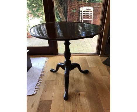 A 19th century mahogany circular tilt-top occasional table on a later turned stem, tripod legs and pad feet.  28½ins diameter