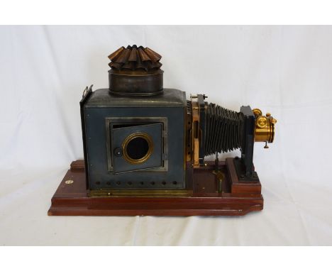 A Victorian magic lantern projector by Thornton Pickard on a mahogany plinth base.  Est £150-200