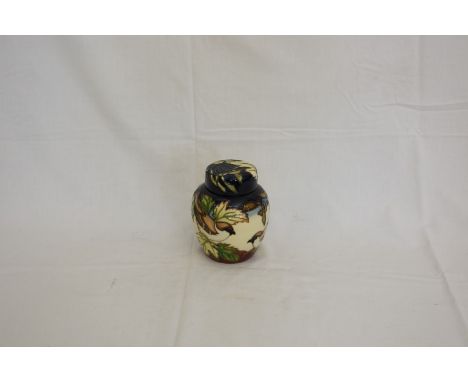 A Moorcroft ginger jar and cover decorated with chaffinches and blackbirds.  Dated to base 2002.  6¼ins.  Est £60-80