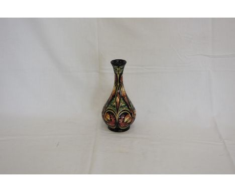 A Moorcroft Solomon pattern vase made for Liberty 2004 with raised flower head and leaf decoration.  Numbered 147/150 and wit