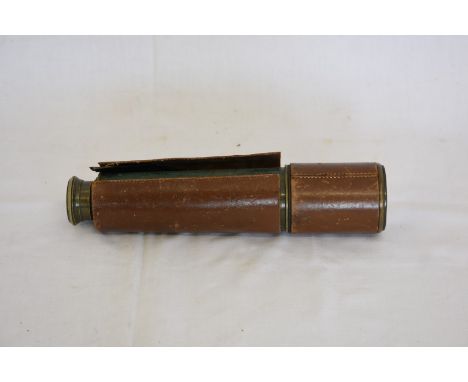 A world war II three draw telescope with brown leather wrapped top section, the first draw engraved TEL.SCT.REGTS.MK.II. S E.