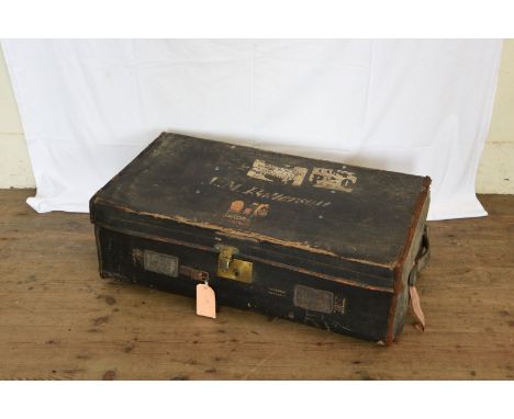 A leather and wooden travelling trunk with wheels to the lower section, a canvas suitcase, a metal ammunition trunk. Est £25-