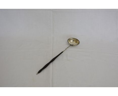 A George III silver toddy ladle with beaded bowl and twisted baleen handle.  London 1796.  Makers mark rubbed.  Est £20-40