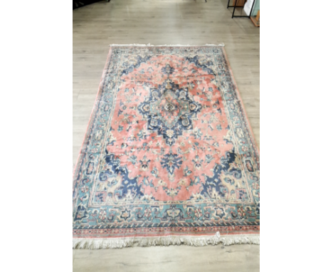 A 266 X 183 FRINGED CARPET