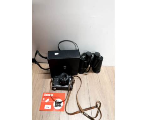 A PAIR OF BINOCULARS AND A VINTAGE ZENITH CAMERA