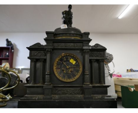 Classical style slate mantle clock decorated with cherub frieze panels and Greek style topper, 56 cm high x 40 cm long x 17 c