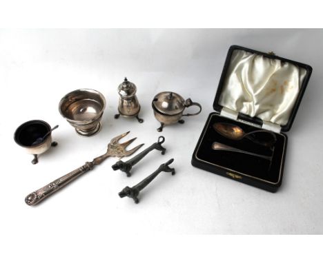 Silver cruet, silver handled fork, pair of white metal knife rests and cased silver spoon and food pusher 