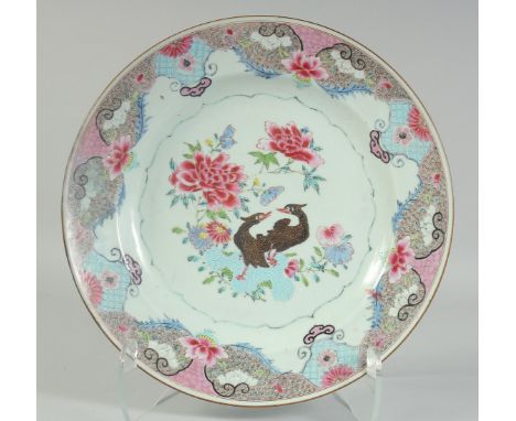 A CHINESE FAMILLE ROSE PORCELAIN CHARGER, enamel painted with birds and native flora, 35cm diameter.