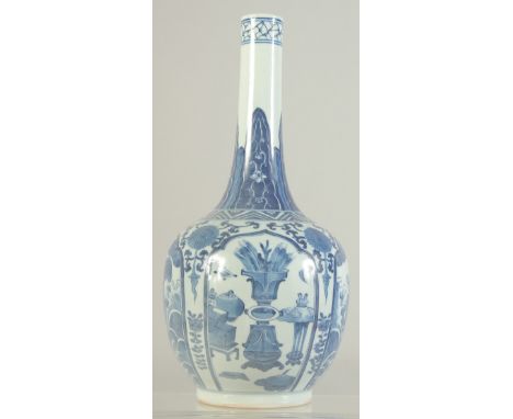 A CHINESE BLUE AND WHITE PORCELAIN BOTTLE VASE, painted with panels of beasts and objects, the base with Kangxi character mar