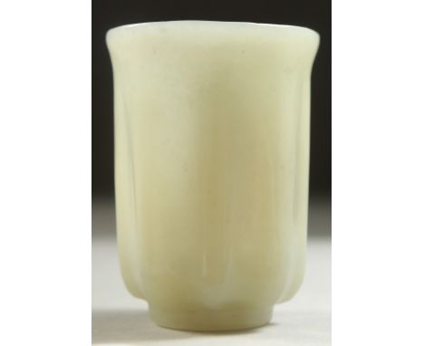 A SMALL CARVED JADE CUP, 4.5cm high.