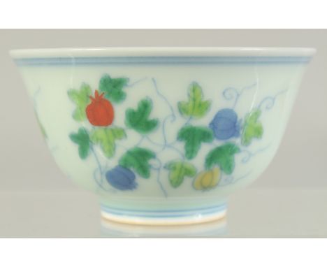 A CHINESE DOUCAI PORCELAIN CUP, decorated with fruits, 8.5cm diameter.