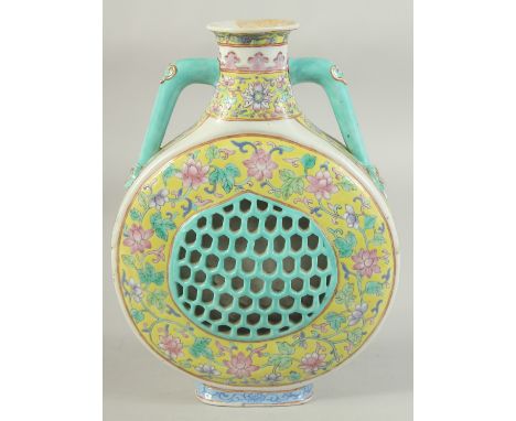 A 19TH CENTURY CHINESE FAMILLE JAUNE PORCELAIN TWIN HANDLE FLASK VASE, with pierced central panel and foliate decoration, the
