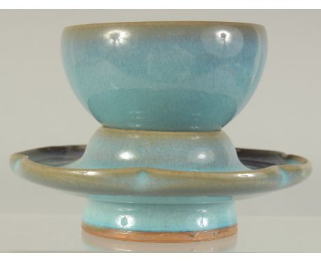 A CHINESE JUN WARE CUP ON PETAL-FORM STAND, cup 8cm diameter, 12cm diameter.