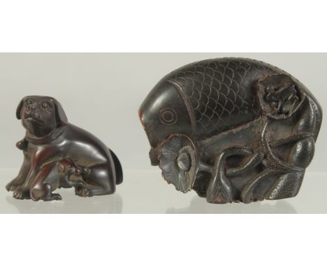 A FINELY CARVED CHINESE SNUFF BOTTLE IN THE FORM OF A FISH, together with a Japanese wooden netsuke of a dog, (2).