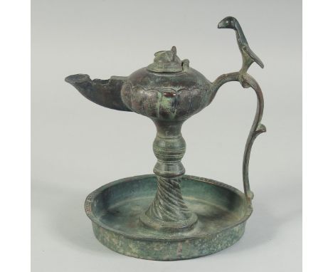 A FINE 12TH-13TH CENTURY PERSIAN SELJUK BRONZE OIL LAMP, with bird-form finial, 19cm high.