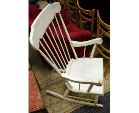 An early 20th century stick back rocking chair, painted white 