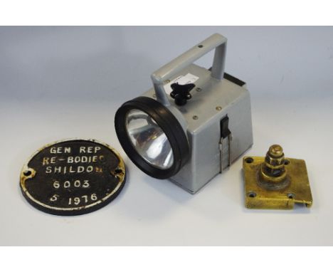 Railwayana - a British Rail lamp; a cast iron wagon plate; a GWR brass fitting, salvaged from a disaster (3)
