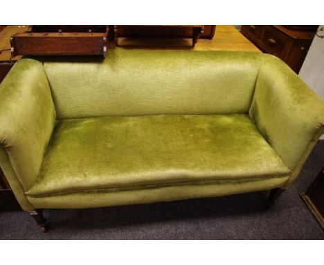 An Arts &amp; Crafts settee, high back, scrolled arms, ceramic casters