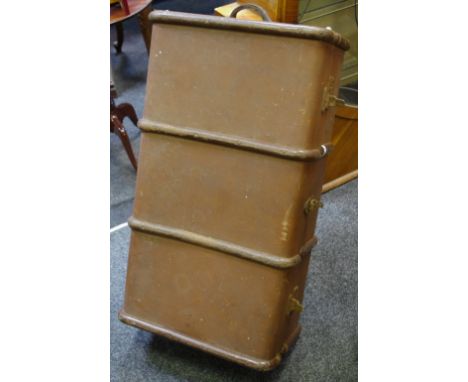A wood bound cabin trunk, leather handles