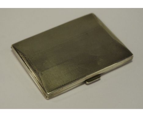 A silver cigarette case, engine turned
