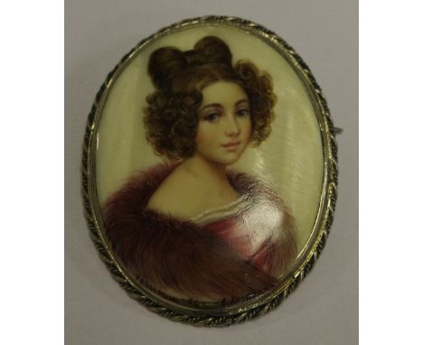 A late 19th century Russian conch shell portrait miniature brooch of an elegant young lady, indistinctly signed 