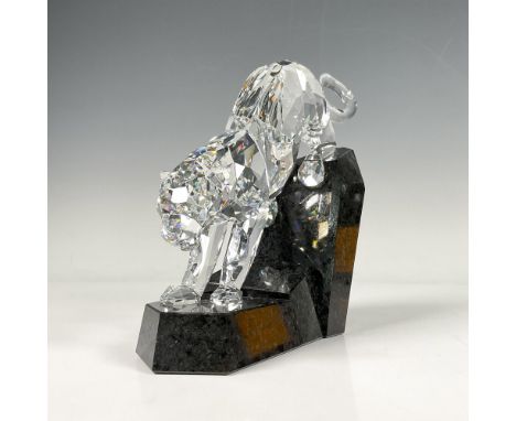 Dynamic crystal figure in jumping pose set on stepped onyx base. Part of Soulmates Collection. Signed by artist. Swarovski ba