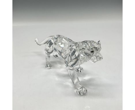 Part of the African Wildlife theme group. A clear facetted crystal feline stalking with brown crystal eyes. Swarovski backsta